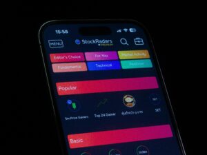 Close-up of a smartphone displaying a financial stock trading app interface.