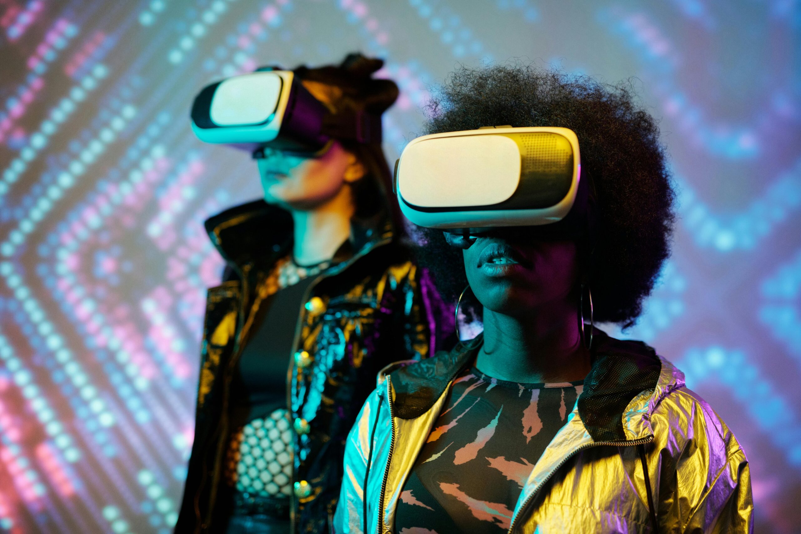 Exploring virtual reality with futuristic headsets in a vibrant setting.